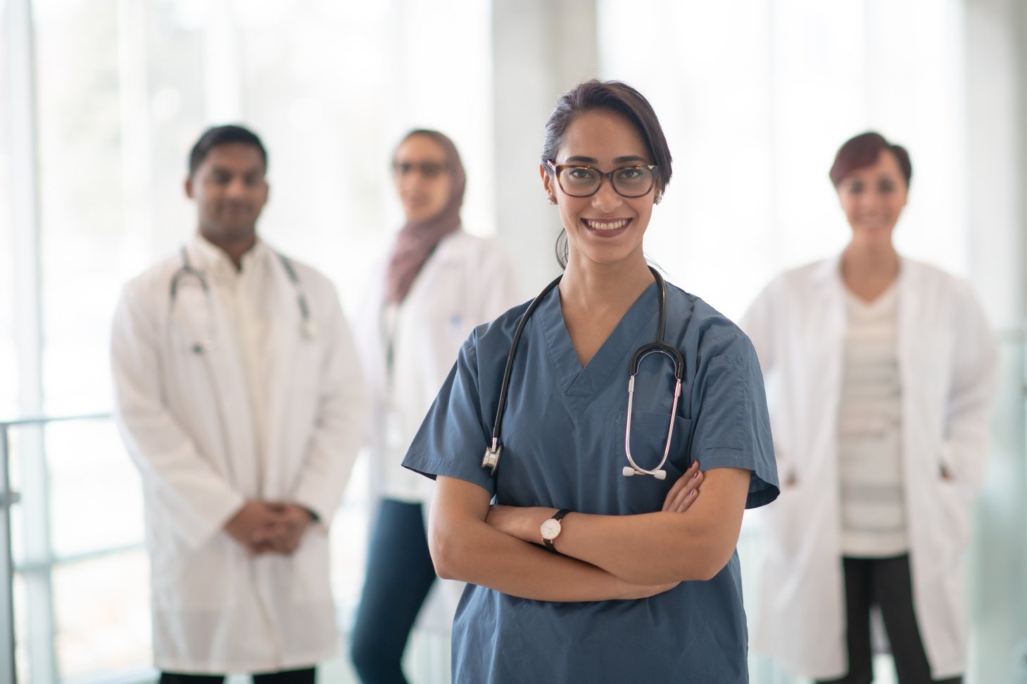 Medical Team Lead by Female East Indian Doctor stock photo